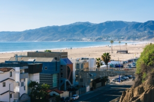 view of california beach and mountains with buildings in the forefront