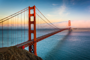 view of famous san Francisco red bridge at sunset  over the water