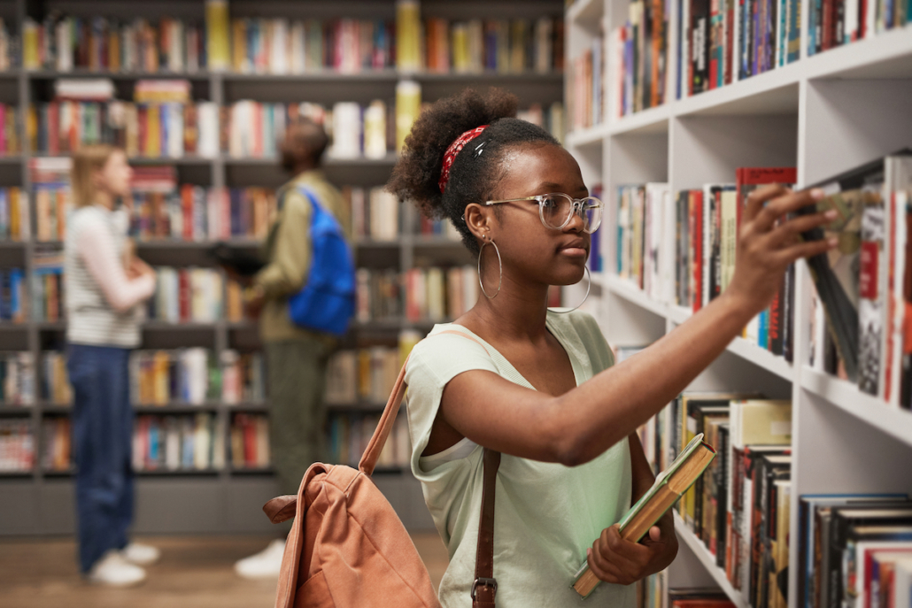 Girl browsing books in a library that has been relocated