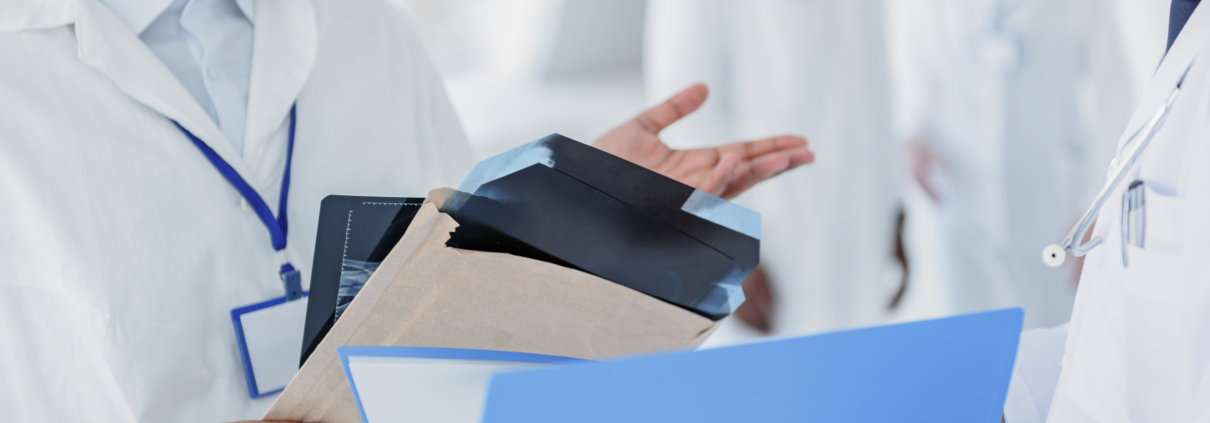 doctors with paperwork in a hospital during a relocation