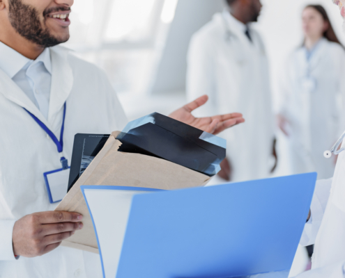 doctors with paperwork in a hospital during a relocation